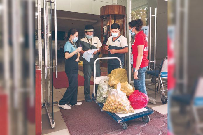 Healthcare workers of the Antique Medical Center, Inc. in San Jose town receive locally produced vegetables from their provincial government on May 1. The provincial government here will purchase P15 million worth of test kits for frontliners in the fight against coronavirus disease 2019. JASON ALAGOS
