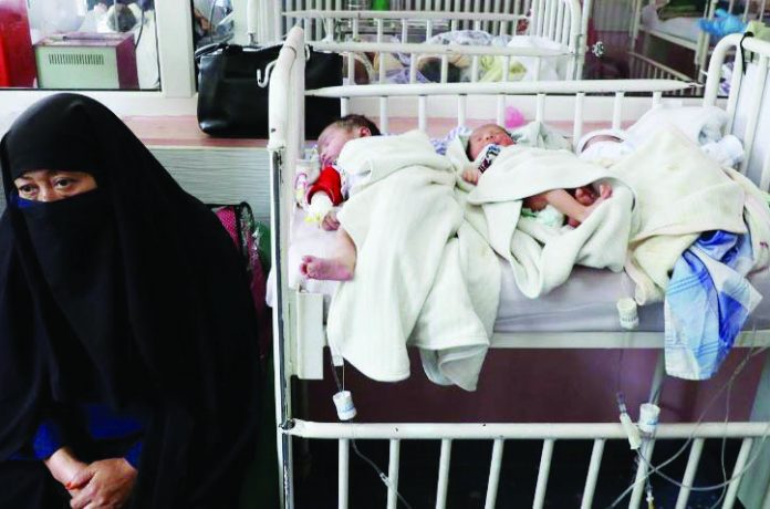 Newborn children who lost their mothers during the yesterday's attack lie on a bed at a hospital, in Kabul, Afghanistan May 13, 2020.
