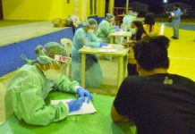 Nurses at the Provincial Healting Center in E.B. Magalona, Negros Occidental cater the overseas Filipino workers who underwent a 14-day mandatory quarantine for coronavirus disease 2019 upon their arrival on April 14. PIO NEGROS OCCIDENTAL