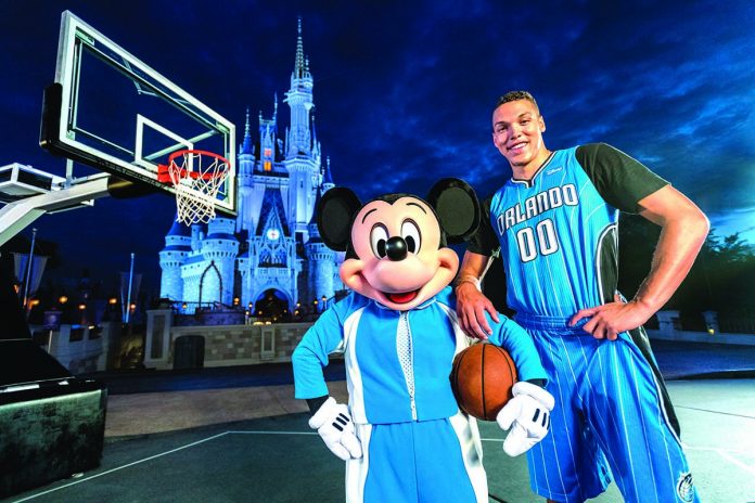 Orlando Magic’s Aaron Gordon poses for a photo with Mickey Mouse at Disney World in Florida, United States.