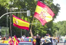 Spain’s far-right holds car protest vs virus lockdown