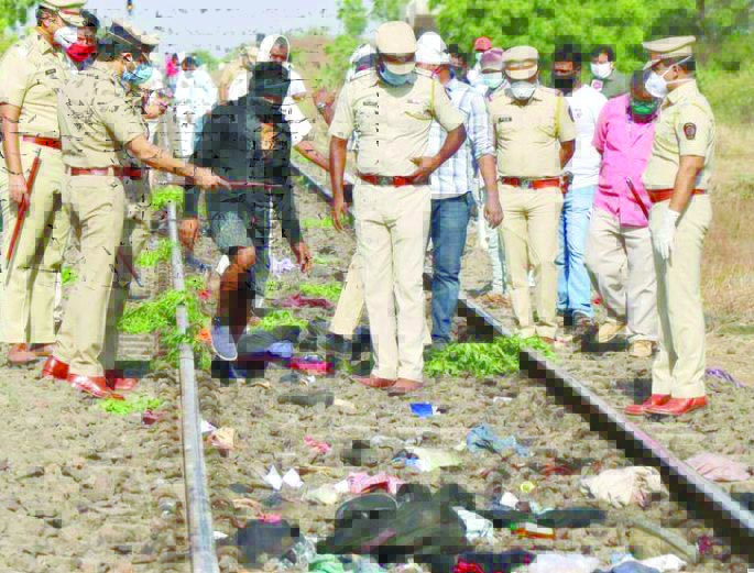 Police officers examine the railway track after a train ran over migrant workers sleeping on the track in Aurangabad Police officers examine the railway track after a train ran over migrant workers sleeping on the track in Aurangabad district in the western state of Maharashtra, India, May 8, 2020. REUTERS