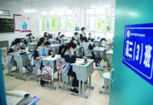 Students in China’s virus epicenter return to school