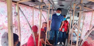 SOCIAL DISTANCING TEST. Officials of the Iloilo City government’s Public Safety and Transportation Management Office inspect the interior of a modern jeepney. They are shown here trying to observe social distancing. Yes, it’s possible, they say. IAN PAUL CORDERO/PN