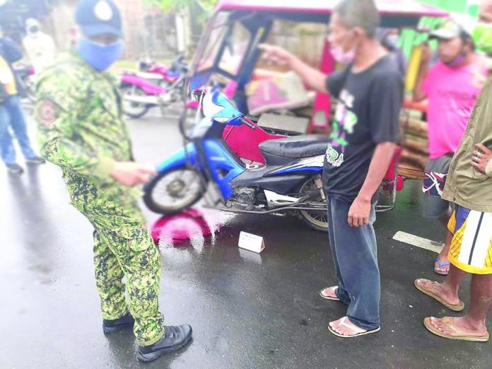 This police officer interviews a witness of the shooting incident that killed Vevincio Aguilar