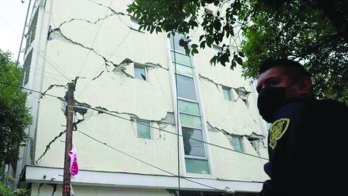 A building sustained cracks after a strong quake hits Mexico.
