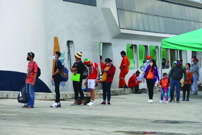 A total of 195 Antiqueño locally stranded individuals arrive home from Metro Manila via a roll-on, roll-off vessel that docked at the Lipata port in Culasi town on June 25.