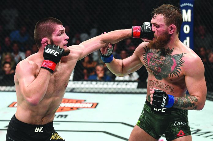 Conor McGregor gets punched by arch-rival Khabib Nurmagomedov