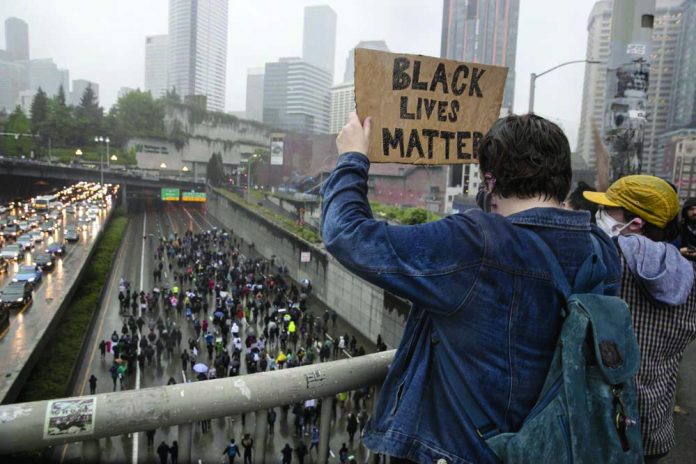 Crowds demonstrate against police brutality on I-5 in Seattle, Saturday, May 30, 2020.