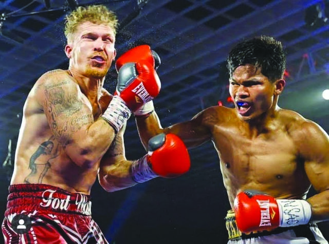 Negrense boxer Reymond Yanong lands a punch on the face of American Clay Burns during their bout at the MGM Grand Garden Arena in Las Vegas, Nevada, United States on June 26.