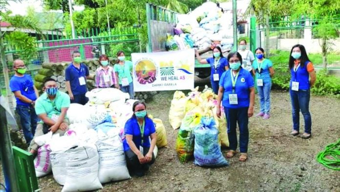 Personnel of the Department of Agrarian Reform DAR-Negros Occidental II deliver food packs to their agrarian reform beneficiaries in the southern part of the province last month.