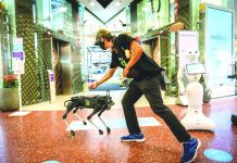 Robot dog hounds Thai shoppers to keep hands coronavirus-free