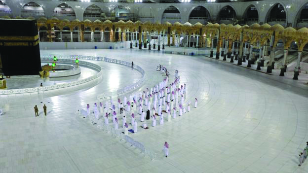 Socially-distanced worshippers pray in Mecca.