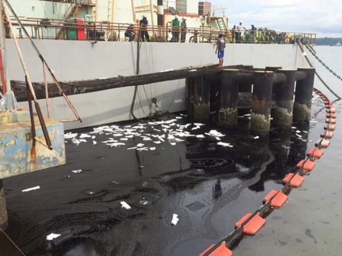 Barge explosion triggers oil spill