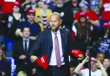 Brad Parscale, manager of President Donald Trump's reelection campaign, throws "Make America Great Again," hats to the audience before a rally in Grand Rapids, Michigan, United States. AP