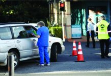 New Zealand to charge COVID-19 patient who went shopping Car passengers wait for COVID-19 tests in Auckland in mid-June after two people returning to New Zealand tested positive. A review has found the country’s managed isolation and quarantine facilities are under ‘extreme stress.’ GETTY IMAGES