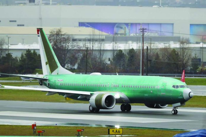 In this Dec. 11, 2019, file photo, a Boeing 737 Max being built for Norwegian Air International taxis for a test flight, at Renton Municipal Airport in Renton, Wash.