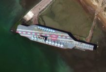 Iran fires missile at mock aircraft carrier amid US tensions In this Feb. 15, satellite photo provided on July 27 by Maxar Technologies, a mockup aircraft carrier built by Iran is seen at Bandar Abbas, Iran, before being put to sea. MAXAR VIA AP
