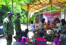 Negros Occ. police top performer in W. Visayas Police personnel conduct feeding program to residents of Barangay San Jose, Binalbagan, Negros Occidental on July 15. Negros Occidental Police Provincial Office officer-in-charge Colonel Romy Palgue commended his men for their recognition as the top-performing unit in Western Visayas for June. BINALBAGAN PNP