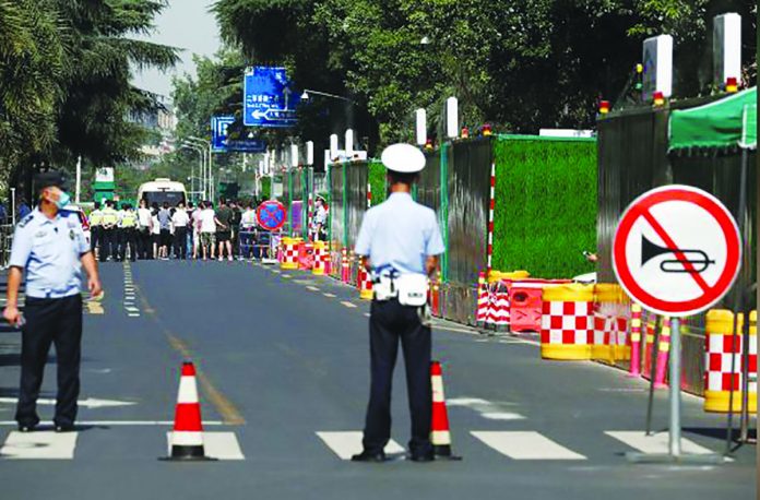 Police stand at a cordon near the U.S. Consulate General in Chengdu, Sichuan province, China Police stand at a cordon near the U.S. Consulate General in Chengdu, Sichuan province, China, July 27, 2020, as a deadline is due to expire for the departure of the final group of U.S. personnel from the consulate after China ordered its closure in response to a U.S. order for China to shut its consulate in Houston. REUTERS