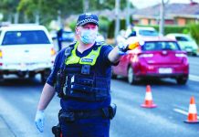 New restrictions coming for Australian hot spot Police stop drivers at a checkpoint, set up in response to the state of Victoria’s surge in coronavirus disease cases and resulting suburb lockdowns, in Melbourne, Australia. REUTERS