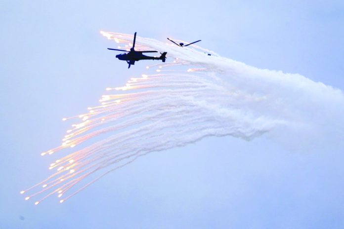 Taiwan's AH-64E Apache attack helicopter launches flares during the 36th Han Kung military exercises in Taichung City, central Taiwan on July 16, 2020. Taiwan's AH-64E Apache attack helicopter launches flares during the 36th Han Kung military exercises in Taichung City, central Taiwan on July 16, 2020. AP PHOTO/CHIANG YING-YING