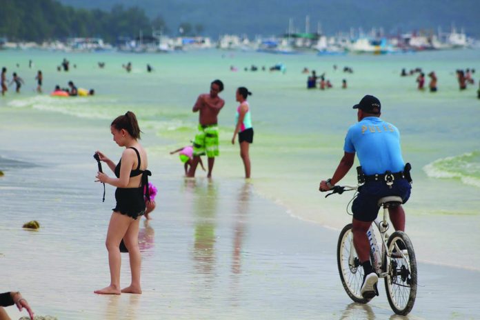 Tourists enjoy their time in the world famous Boracay Island in Malay Tourists enjoy their time in the world famous Boracay Island in Malay, Aklan in this undated photo. Acting Malay mayor Floribar Bautista said they will reduce the curfew hours in the world-class island resort. BOY RYAN ZABAL/AKEAN FORUM