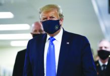 Trump wears mask in public for first time during virus pandemic United States President Donald Trump wears a mask as he walks down the hallway during his visit to Walter Reed National Military Medical Center in Bethesda, Md., Saturday, July 11, 2020. AP PHOTO/PATRICK SEMANSKY
