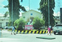3 WVMC workers contract COVID-19: 4 hospital areas on lock down People walk past the front of Western Visayas Medical Center’s emergency room in Mandurriao, Iloilo City.