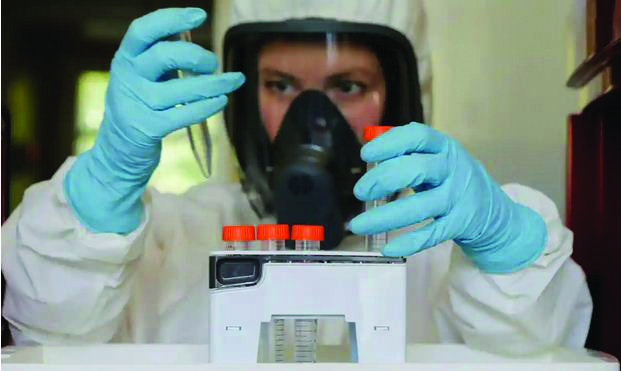 A scientist at the Gamaleya Institute during the production and laboratory testing of the Sputnik-V vaccine. REUTERS A scientist at the Gamaleya Institute during the production and laboratory testing of the Sputnik-V vaccine. REUTERS