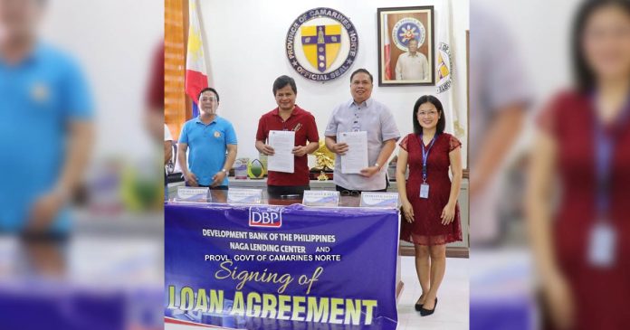 DBP Camarines Norte Provincial Governor Edgardo A. Tallado and DBP Senior Assistant Vice President Ariel B. Pena (2nd and 3rd from left, respectively) are shown during the signing of the loan agreement. Joining them are Provincial Attorney Don H. Culvera (left) and DBP Assistant Manager Helen D. Jacinto.