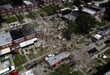 1 dead, 6 rescued in Baltimore gas explosion Debris and rubble covers the ground in the aftermath of an explosion in Baltimore on Monday, Aug. 10, 2020. AP