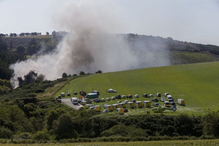 Emergency services attend the scene of a derailed train in Stonehaven, Scotland, Emergency services attend the scene of a derailed train in Stonehaven, Scotland, Wednesday Aug. 12, 2020. ROSS JOHNSTON/NEWSLINE-MEDIA VIA AP