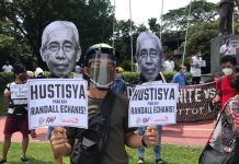 In a rally held at the Commission of Human Rights compound, protesters call for justice for the death of Echanis, a peace consultant of the National Democratic Front of the Philippines. ANAKPAWIS