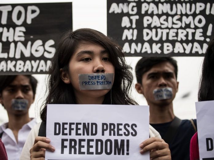 In this file photo, college students protest to defend press freedom in Manila after the government cracked down on Rappler, an independent online news site. NOEL CELIS/AFP/GETTY IMAGES