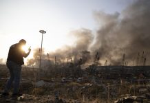 Aftermath of a massive explosion is seen in in Beirut, Lebanon, Tuesday, Aug. 4, 2020. Massive explosions rocked downtown Beirut on Tuesday, flattening much of the port, damaging buildings and blowing out windows and doors as a giant mushroom cloud rose above the capital. Witnesses saw many people injured by flying glass and debris. (AP Photo/Hassan Ammar)