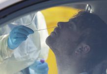 Puzzling New Zealand virus outbreak grows to 17 cases Medical staff take a COVID-19 test from a visitor to a drive through community based assessment centre in Christchurch, New Zealand, Thursday, Aug. 13, 2020. AP