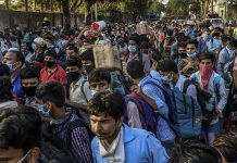 India coronavirus deaths hit 50,000 Migrant workers crowd outside a train station in Mumbai, India to board trains to their home state, Bihar, on May 20, 2020. Migrant workers are becoming infected with the coronavirus at an alarmingly high rate, leading to fresh outbreaks in villages across northern India. THE NEW YORK TIMES