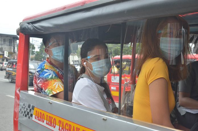 Passengers wearing face shields and masks for protection against coronavirus ride a jeepney with plastic barriers inside to maintain social distancing Passengers wearing face shields and masks for protection against coronavirus ride a jeepney with plastic barriers inside to maintain social distancing. Starting Aug. 15, passengers using any mode of public transportation are required to wear face shields. With this new policy, residents as early as Wednesday rushed to buy face shields. It could block potential transmission of by up to 98 percent, according to health authorities. IAN PAUL CORDERO/PN FACE SHIELD VS COVID