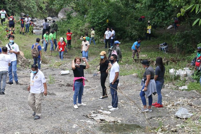 Provincial and national government employees, non-government organizations representatives and the academe take part in the tree planting activity during Antique’s kickoff of the Dulungan Month celebration in Barangay Flores, Culasi town on Aug. 3. PROVINCE OF ANTIQUE