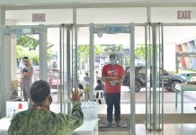 No facemask, no face shield no entry at prov’l capitol TOUGH SCREENING; A security personnel stops a man about to enter the Iloilo provincial capitol. The man must first undergo body thermal scanning. If he is feverish, he would be turned away. Aside from a temperature scan, people entering the capitol are also required to wear facemask and face shield. IAN PAUL CORDERO/ PN