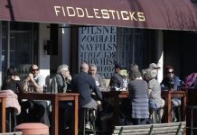 New Zealand marks 100 days of coronavirus elimination Customers at a cafe enjoy lunch in the sunshine in Christchurch, New Zealand, Sunday, Aug. 9, 2020. New Zealand marked a 100 days of being free from the coronavirus in its communities. AP