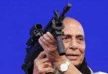 India to ban imports of military equipment In this Feb. 7, 2020 file photo, Indian Defense Minister Rajnath Singh holds a model of a light machine gun during DefExpo20 in Lucknow, India. AP