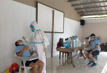 Over 250 cops take COVID-19 test Personnel of the Iloilo City Health Office collect mouth swab samples from a police officer inside Multipurpose Hall of Camp Delgado. More than 250 personnel of the Police Regional Office 6 and Iloilo Police Provincial Office had their specimens collected for coronavirus disease 2019 testing. IAN PAUL CORDERO/PN