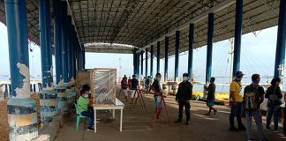 A police officer guards the wharf in Buenavista, Guimaras on Aug. 11. Protocols at the wharves in Guimaras have been tightened to avoid the spread of COVID-19 in the island province. BUENAVISTA MPS GUIMARAS PROVINCE