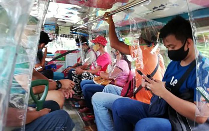region-antique Passengers of a public utility jeepney comply with the mandatory wearing of face masks rule in Antique in this undated photo. The Department of the Interior and Local Government in the province said 12 local government units have submitted their ordinances on quarantine and health safety standard protocols before the Aug. 14 deadline. PNA