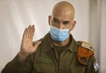 Facing a coronavirus crisis, Israel calls in the army Maj. Gen. Ori Gordin, head of the Israeli army’s Home Front Command, gestures as he speaks at its headquarters, in Ramle, Central Israel, Tuesday, Aug. 25, 2020. AP