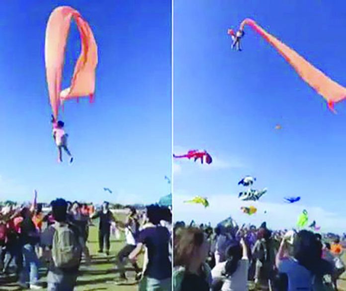 The girl was dragged up into the air by the kite tail The girl was dragged up into the air by the kite tail. FACEBOOK