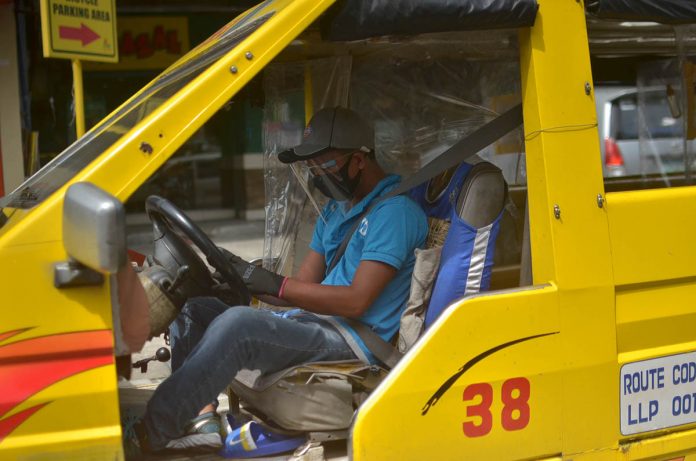 drivers exempted A public utility jeepney driver wears a facemask on top of a face shield in Iloilo City. In the interest of road safety, the city council passed an ordinance exempting drivers of public and private vehicles from wearing face shield while driving. IAN PAUL CORDERO/PN