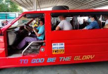 Commuters onboard a jeepney wear face shields and facemasks as protection against the spread of coronavirus. The government is reducing physical distancing in public transportation to help the public transport sector recover from the slump caused by lockdown measures. But several mayors in Iloilo province fear this move could increase the risk of virus transmission. IAN PAUL CORDERO/PN